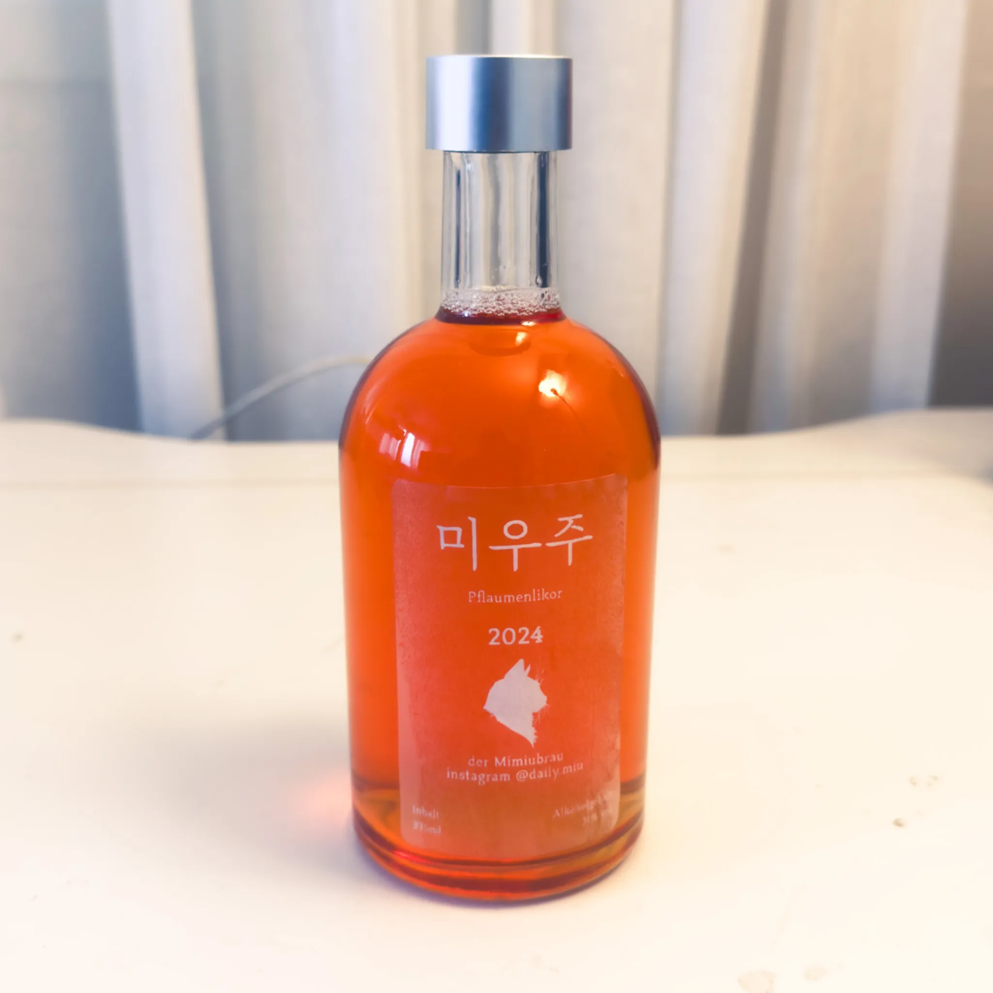 Miuju 2024 bottle in a cozy setting